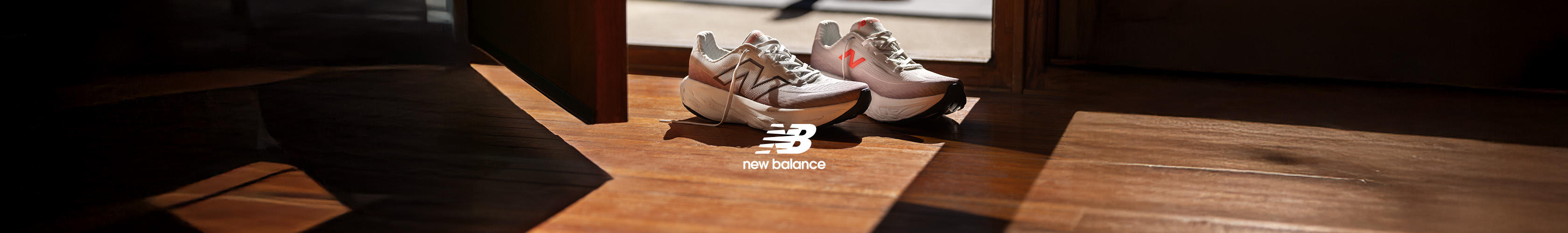 Shop New Balance 1080 v14 running shoes. A pair of NB trainers by the door