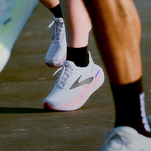Shop running shoes. A close-up of running shoes on runners feet